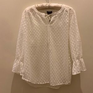 Sweet feminine blouse with raised circle print throughout.